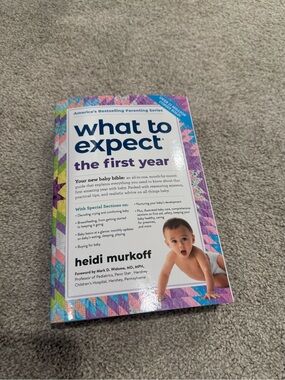 What to Expect the First Year by Heidi Murkoff - White & Purple Cover